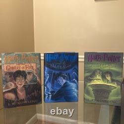 Ensemble complet de Harry Potter en édition reliée comprenant les premières éditions, 9 livres de JK Rowling
