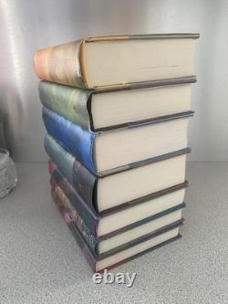 Lot complet Harry Potter 1-7 en reliure rigide avec jaquettes, toutes premières éditions américaines